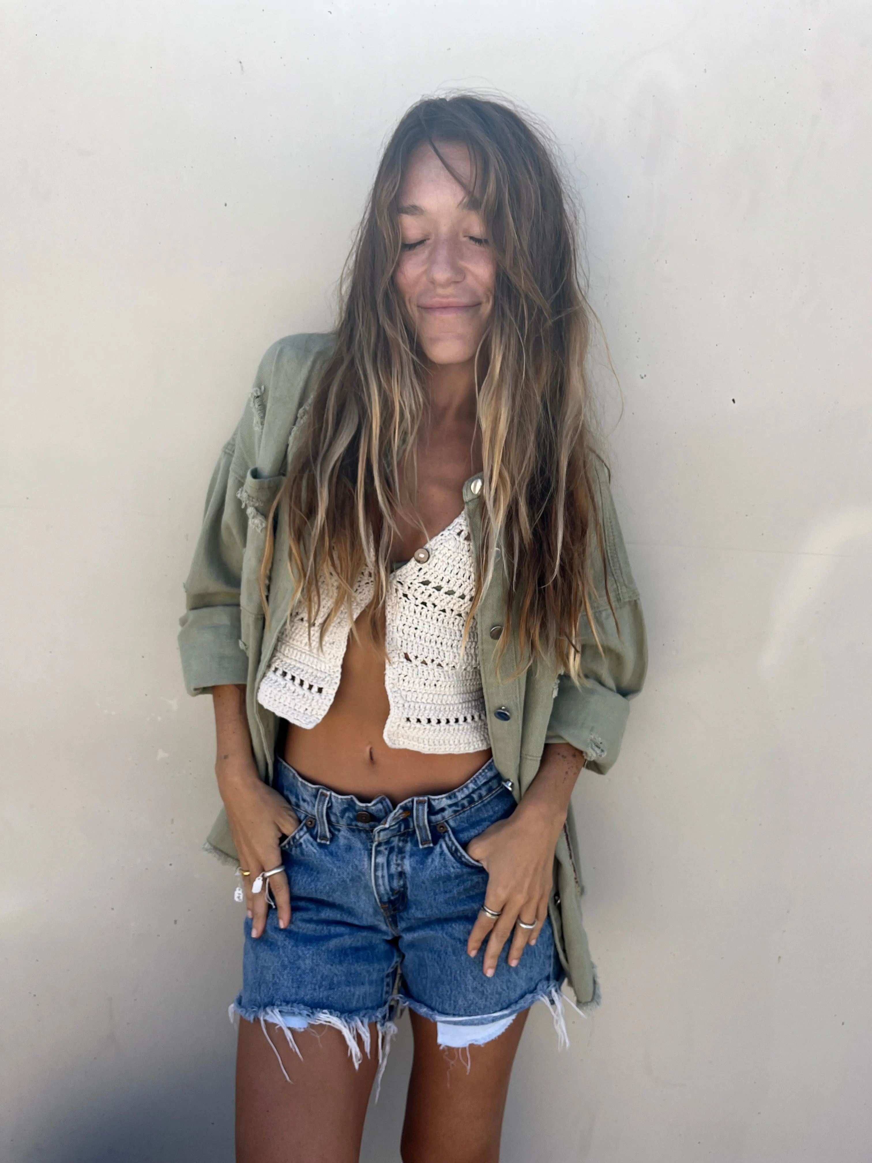 She is a surfer green jacket